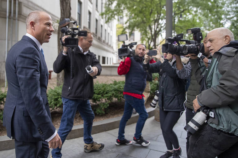 ASSOCIATED PRESS
                                Attorney Michael Avenatti, left, is surrounded by photographers as he leaves Manhattan Federal court today in New York.