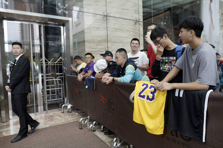 ASSOCIATED PRESS
                                Chinese basketball fans gather outside of a hotel for a press conference that was later postponed ahead of an NBA preseason basketball game on Thursday between the Los Angeles Lakers and Brooklyn Nets in Shanghai, China. The NBA has postponed Wednesday’s scheduled media sessions in Shanghai for the Brooklyn Nets and Los Angeles Lakers, and it remains unclear if the teams will play in China this week as scheduled.