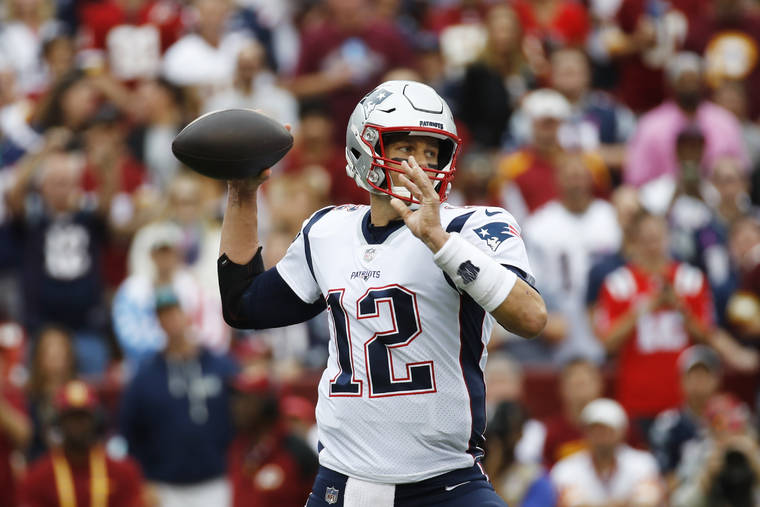 ASSOCIATED PRESS / OCT. 6
                                New England Patriots quarterback Tom Brady (12) works in ther pocket against the Washington Redskins during the first half of an NFL football game in Washington.