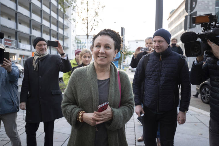 FRISO GENTSCH/DPA VIA ASSOCIATED PRESS
                                Polish author Olga Tokarczuk smiled as she arrived for a press conference in Bielefeld, Germany, today. Tokarczuk was named recipient of the 2018 Nobel Prize in Literature, today.