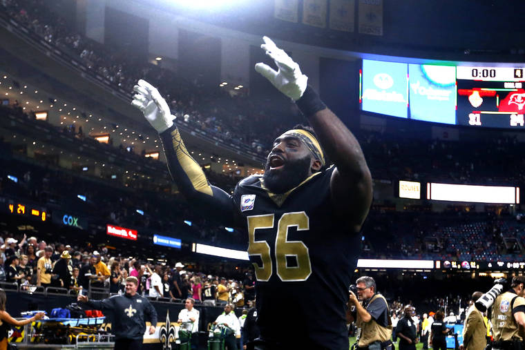 ASSOCIATED PRESS
                                New Orleans Saints outside linebacker Demario Davis (56) celebrates after an NFL football game against the Tampa Bay Buccaneers in New Orleans on Sunday. The Saints won 31-24.