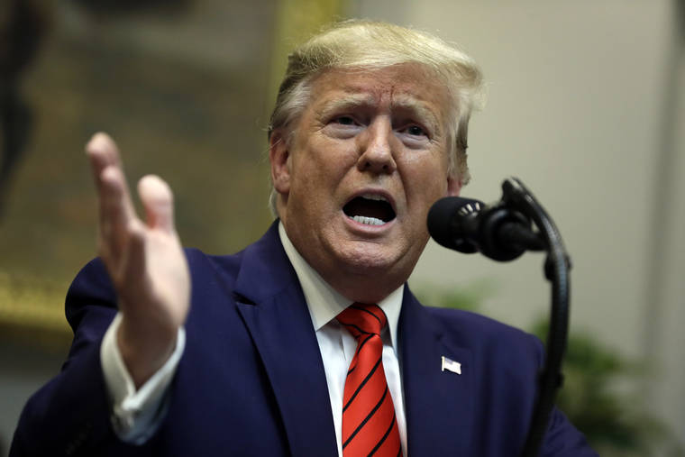 ASSOCIATED PRESS
                                President Donald Trump answers questions from reporters during an event on “transparency in Federal guidance and enforcement” in the Roosevelt Room of the White House Wednesday in Washington.