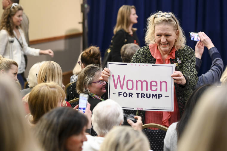 ASSOCIATED PRESS
                                A Trump supporter posed with her sign before the start of a “Women for Trump” event at the Union Depot, in St. Paul. Minn., Wednesday.