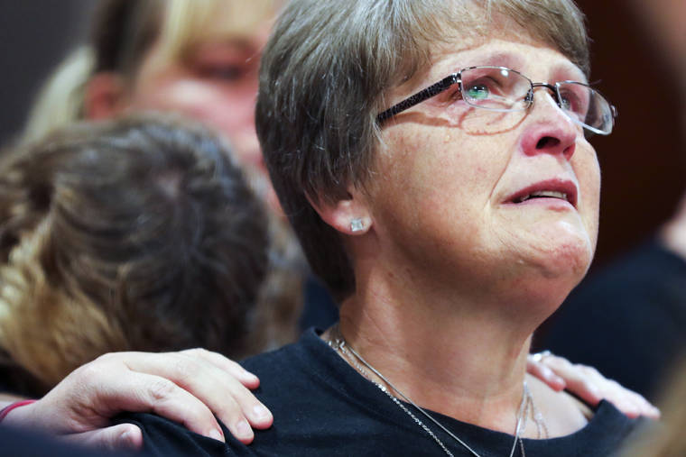 BRIAN HAYES/THE GRAND RAPIDS PRESS VIA AP
                                Kristine Young, mother of Ashley Young, reacts at the sentencing of Jared Chance in Kent County Circuit Court, Thursday, Oct. 10, 2019, in Grand Rapids, Mich. Chance, a Michigan man convicted of killing and dismembering Ashley Young has been sentenced to at least 100 years in prison after a judge called his actions “reprehensible and heinous.”