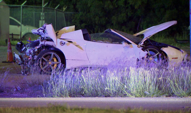 KDFW FOX4 VIA AP
                                This photo taken from video provided by KDFW Fox 4 shows the scene after welterweight boxing champion Errol Spence crashed a speeding Ferrari in Dallas early Thursday.