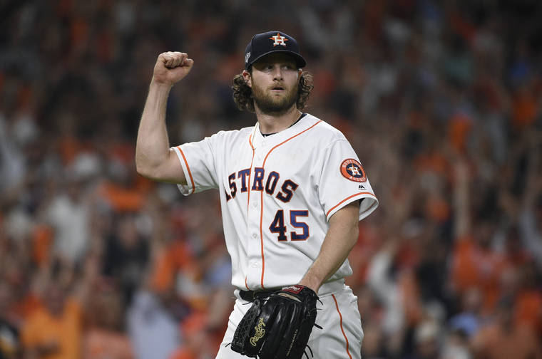 ASSOCIATED PRESS
                                Houston Astros starting pitcher Gerrit Cole reacts after an out against the Tampa Bay Rays during the seventh inning of Game 5 of the American League Division Series in Houston Thursday.