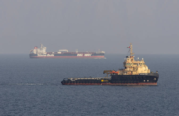 ASSOCIATED PRESS
                                This image, taken from aboard a Royal Navy Wildcat helicopter patrolling the Gulf as part of the International Maritime Security Construct, shows the MV Stena Impero, background, as it sails from the port at Bandar Abbas, Iran, after being released by Iranian officials Friday Sept. 27, 2019. Two rockets struck an Iranian tanker traveling through the Red Sea off the coast of Saudi Arabia on Friday, Iranian officials said.