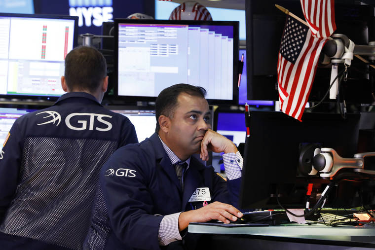 ASSOCIATED PRESS / Oct. 2
                                Specialist Dilip Patel, right, works on the floor of the New York Stock Exchange earlier this month. The U.S. stock market rallied today on news of a thaw in the U.S.-China trade war.