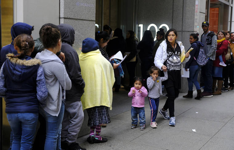ASSOCIATED PRESS
                                In this Jan. 31, 2019 photo, hundreds of people overflow onto the sidewalk in a line snaking around the block outside a U.S. immigration office with numerous courtrooms in San Francisco.