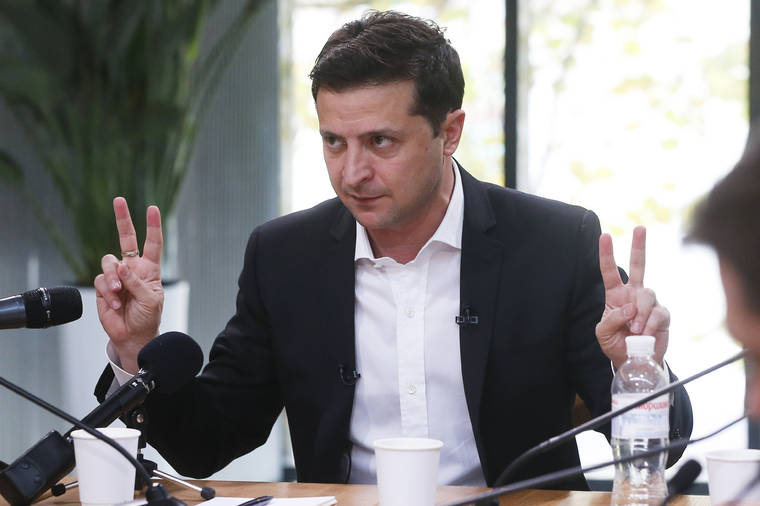 ASSOCIATED PRESS / OCT. 10
                                Ukrainian President Volodymyr Zelenskiy speaks during talks with journalists in Kyiv, Ukraine. Ukrainian President is holding an all-day “media marathon” in a Kyiv food court amid growing questions about his actions as president.