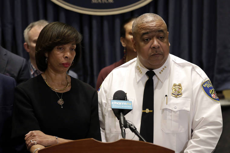 ASSOCIATED PRESS / FEB. 11
                                Baltimore Mayor Catherine Pugh, left, and Michael Harrison, center, acting commissioner of the Baltimore Police Department, listen to a reporter’s question at an introductory news conference for Harrison in Baltimore. Police say a 2-year-old boy was wounded by gunfire when someone shot into a vehicle in an act of road rage. Harrison says the boy is in “somewhat stable condition” and is expected to survive.
