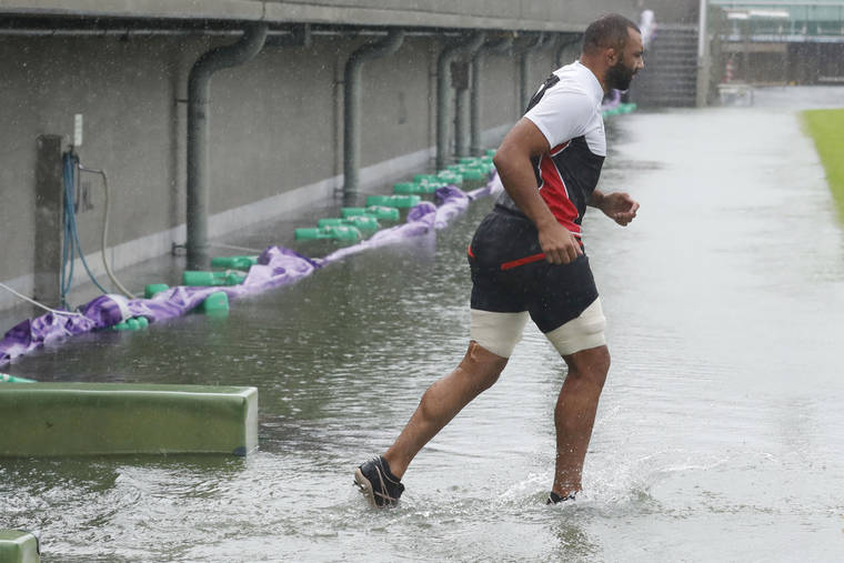 KYODO NEWS VIA AP
                                Japan team’s Michael Leitch works out, ahead of their Rugby World Cup Pool. A match against Scotland as Typhoon Hagibis approaches in Tokyo.