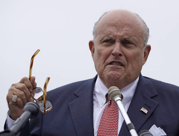 ASSOCIATED PRESS
                                Rudy Giuliani, an attorney for President Donald Trump, spoke in Portsmouth, N.H., in Aug. 2018. A Florida man wanted in a campaign finance case involving associates of Rudy Giuliani is in federal custody after flying today to Kennedy Airport in New York City to turn himself in, federal authorities said.