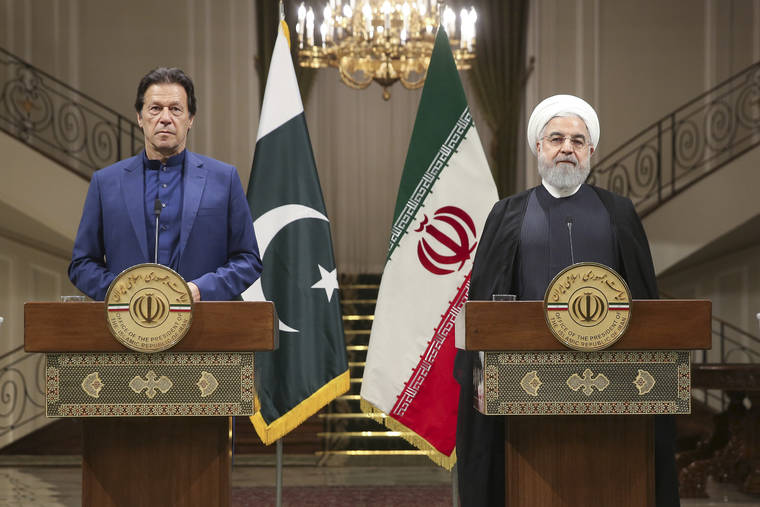 COURTESY OFFICE OF THE IRANIAN PRESIDENCY
                                Iranian President Hassan Rouhani, right, and Pakistani Prime Minister Imran Khan give a joint press conference at the Saadabad Palace, in Tehran, Iran, today.