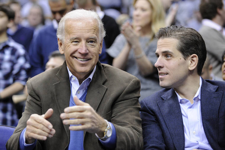 ASSOCIATED PRESS / Jan. 30, 2010
                                Vice President Joe Biden, left, with his son Hunter, right, at the Duke Georgetown NCAA college basketball game in Washington. In an interview today with ABC News, Hunter Biden acknowledged capitalizing on his family’s name, but denied any ethical wrongdoing.