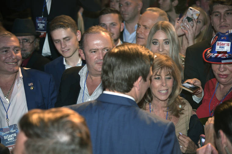 ASSOCIATED PRESS / 2018
                                Florida Gov.-elect Ron DeSantis, center, greets supporters after being declared the winner of the Florida gubernatorial race at an election party in Orlando, Fla. Standing in the crowd are Lev Parnas, left, and next to him Igor Furman. Parnas and Furman are facing criminal charges in connection with President Donald Trump’s attorney Rudy Giuliani’s effort to launch a Ukrainian corruption investigation against Joe Biden and his son Hunter.