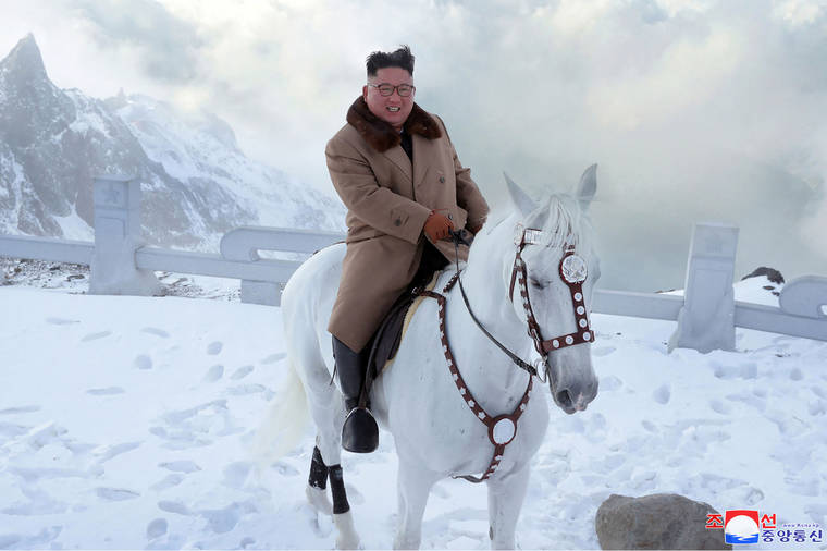 North Korean leader Kim Jong Un rides a white horse to climb Mount Paektu, North Korea. Independent journalists were not given access to cover the event depicted in this image distributed by the North Korean government. The content of this image is as provided and cannot be independently verified. Korean language watermark on image as provided by source reads: “KCNA” which is the abbreviation for Korean Central News Agency.