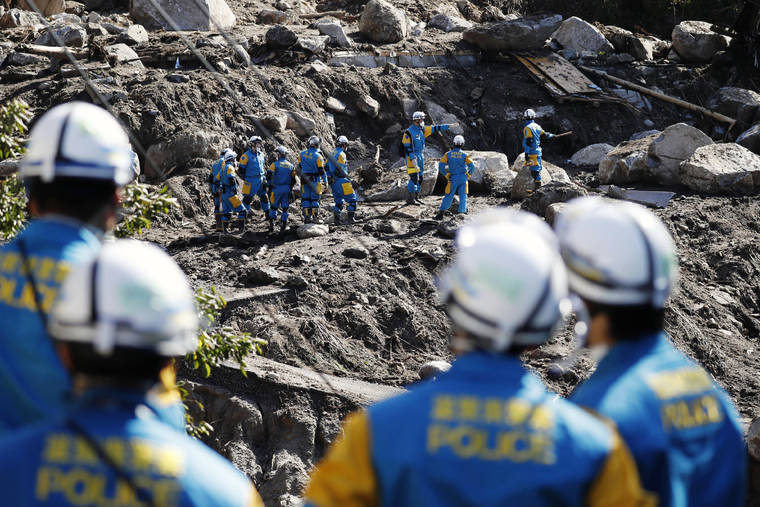 KYODO NEWS VIA ASSOCIATED PRESS
                                Rescuers search for missing persons at the site of a landslide triggered by Typhoon Hagibis, in Marumori town, Miyagi prefecture, Japan, Wednesday. The typhoon hit Japan’s main island on Saturday with strong winds and historic rainfall that caused more than 200 rivers to overflow, leaving thousands of homes flooded, damaged or without power.