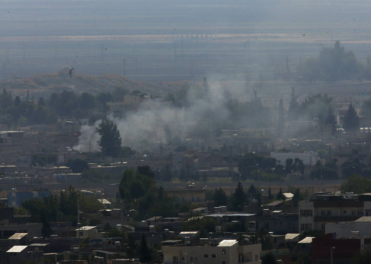 ASSOCIATED PRESS
                                In this photo taken from the Turkish side of the border between Turkey and Syria, in Ceylanpinar, Sanliurfa province, southeastern Turkey, smoke billows from targets in Ras al-Ayn, Syria, caused by shelling by Turkish forces today.