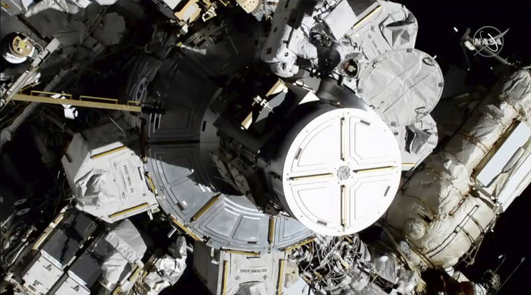 NASA VIA ASSOCIATED PRESS
                                Astronauts Christina Koch and Jessica Meir exits the International Space Station today. The world’s first female spacewalking team is making history high above Earth.