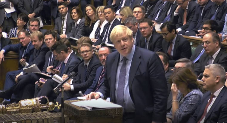 ASSOCIATED PRESS
                                Britain’s Prime Minister Boris Johnson delivers a statement to lawmakers inside the House of Commons to update details of his new Brexit deal with EU, in London Saturday. At a rare weekend sitting of Parliament, Johnson implored legislators to ratify the Brexit deal he struck this week with the other 27 EU leaders.