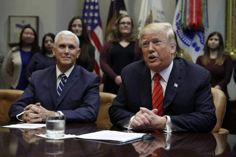 ASSOCIATED PRESS
                                President Donald Trump arrives to speak to NASA astronauts carrying out the first ever all-female spacewalk, during a call from the Roosevelt Room of the White House, Friday, in Washington, as Vice President Mike Pence looks on.