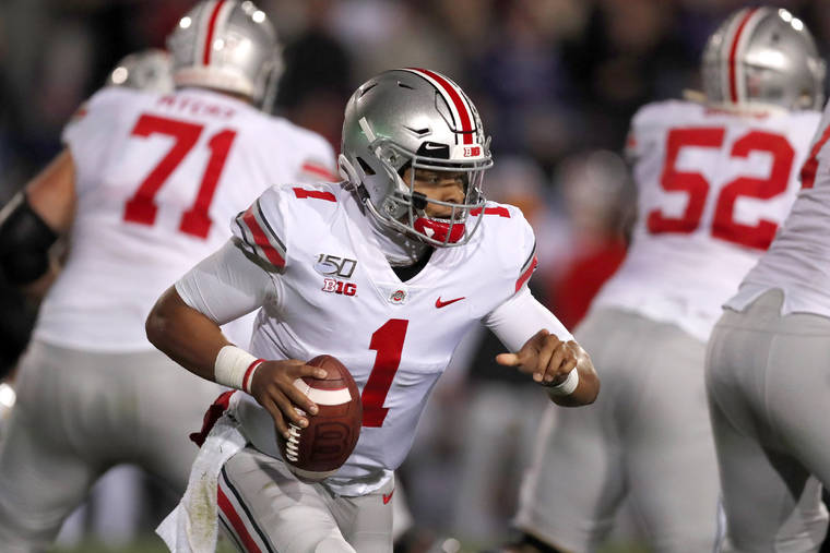 ASSOCIATED PRESS
                                Ohio State quarterback Justin Fields (1) scrambles during the first half of an NCAA college football game against Northwestern on Friday in Evanston, Ill.