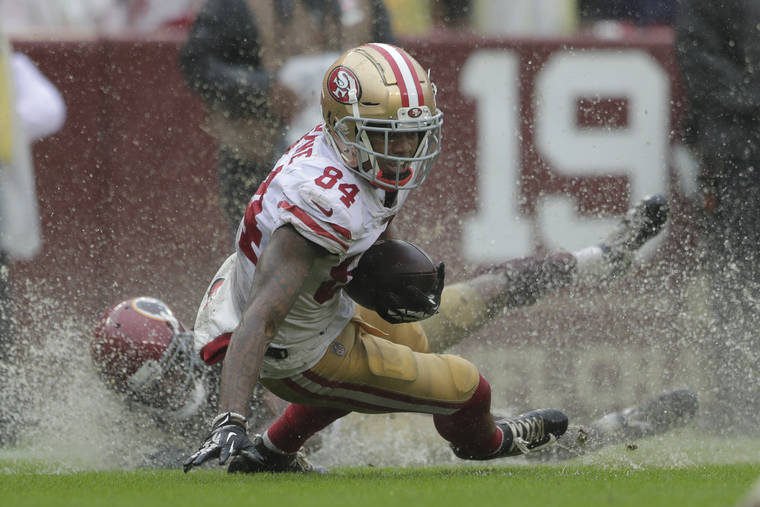 ASSOCIATED PRESS
                                San Francisco 49ers wide receiver Kendrick Bourne rushes the ball in the second half of an NFL football game against the Washington Redskins today in Landover, Md.