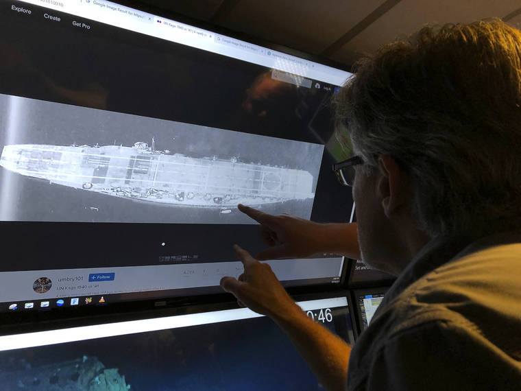 ASSOCIATED PRESS
                                Rob Kraft, Vulcan Inc. director of subsea operations of the Petrel, looks at images of the Japanese aircraft carrier Kaga, off Midway Atoll in the Northwestern Hawaiian Islands on Oct. 16. Deep-sea explorers scouring the world’s oceans for sunken World War II ships are honing in on a debris field deep in the Pacific. The research vessel called the Petrel is launching underwater robots about halfway between the U.S. and Japan in search of warships from the Battle of Midway.