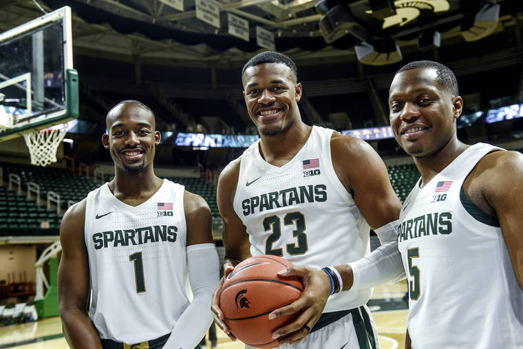 ASSOCIATED PRESS
                                Michigan State’s Joshua Langford, Xavier Tillman and Cassius Winston, from left, pose for a photo during the NCAA college basketball team’s media day on Tuesday, in East Lansing, Mich.