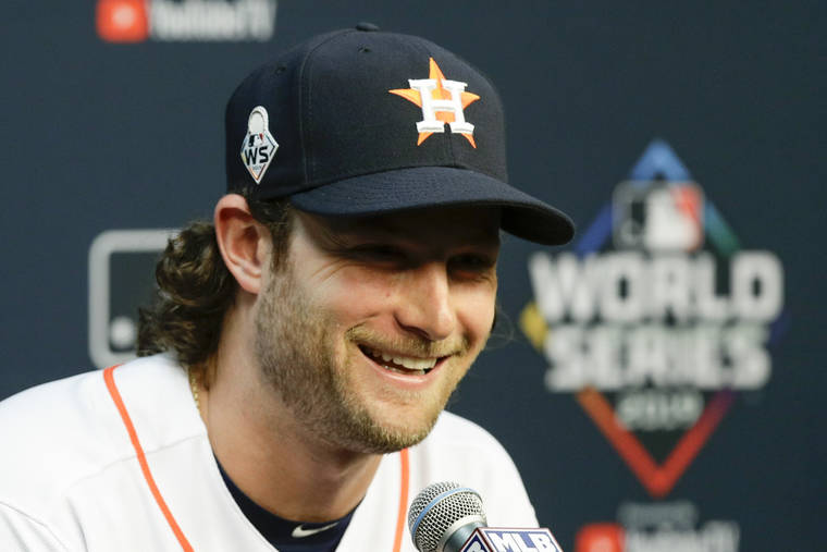ASSOCIATED PRESS
                                Houston Astros starting pitcher Gerrit Cole speaks during a news conference for baseball’s World Series today in Houston. The Houston Astros face the Washington Nationals in Game 1 on Tuesday.