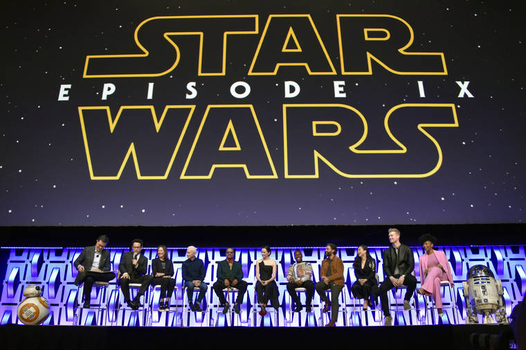 ROB GRABOWSKI/INVISION/ASSOCIATED PRESS
                                Stephen Colbert, from left, J.J. Abrams, Kathleen Kennedy, Anthony Daniels, Billy Dee Williams, Daisy Ridley, John Boyega, Oscar Isaac, Kelly Marie Tran, Joonas Suotamo and Naomi Ackie participated in the “Star Wars: The Rise of Skywalker” panel on day 1, April 12, of the Star Wars Celebration at Wintrust Arena in Chicago. Disney, Monday, debuted the final trailer for “Star Wars: The Rise of Skywalker,” the ninth installment in the “Star Wars” film franchise that tells the story of the powerful Skywalker family.