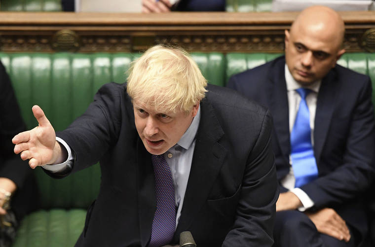 ASSOCIATED PRESS
                                Britain’s Prime Minister Boris Johnson gestures as he speaks in the House of Commons in London during the debate for the EU Withdrawal Agreement Bill on Tuesday.