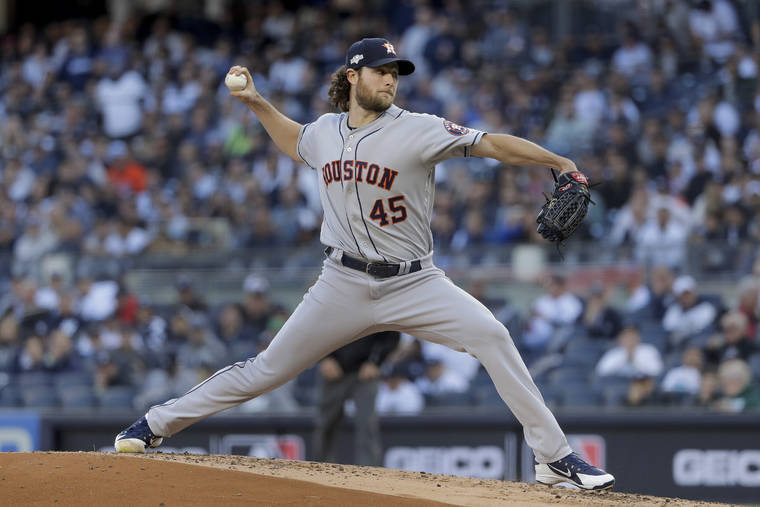 ASSOCIATED PRESS
                                Houston Astros starting pitcher Gerrit Cole (45) delivers against the New York Yankees during the first inning of Game 3 of baseball’s American League Championship Series on Oct. 15 in New York.
