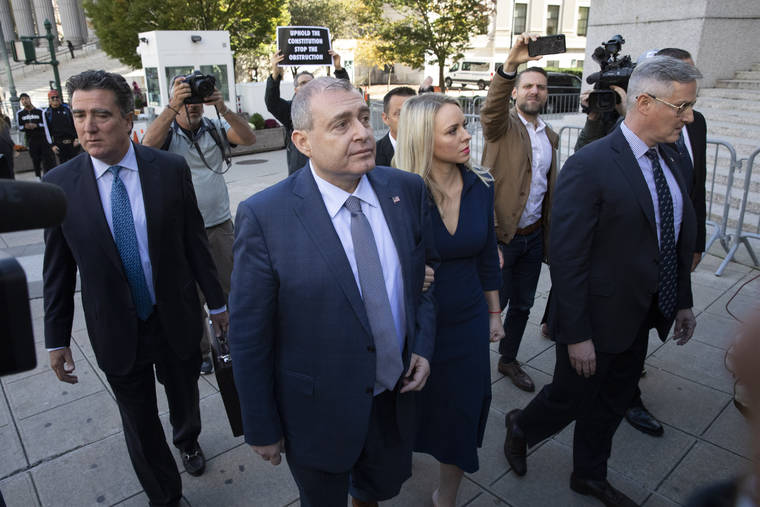 ASSOCIATED PRESS
                                Lev Parnas, center, arrives for his arraignment today in New York. He and Igor Fruman are charged with conspiracy to make illegal contributions to political committees supporting President Donald Trump and other Republicans. Prosecutors say the pair wanted to use the donations to lobby U.S. politicians to oust the country’s ambassador to Ukraine.