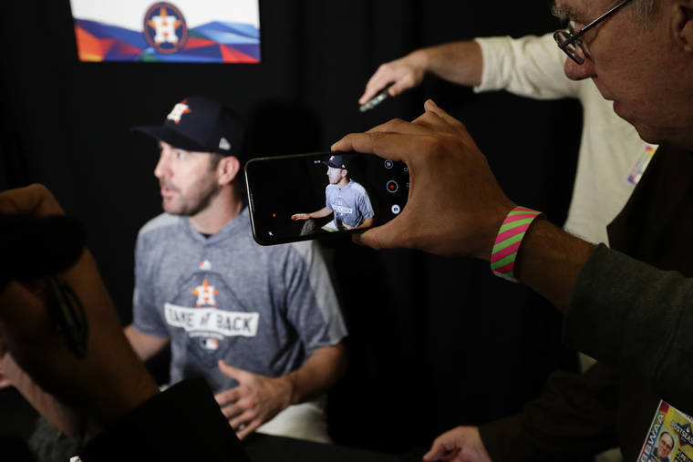 ASSOCIATED PRESS
                                Houston Astros starting pitcher Justin Verlander talks to the media during a practice day for baseball’s World Series on Monday in Houston.