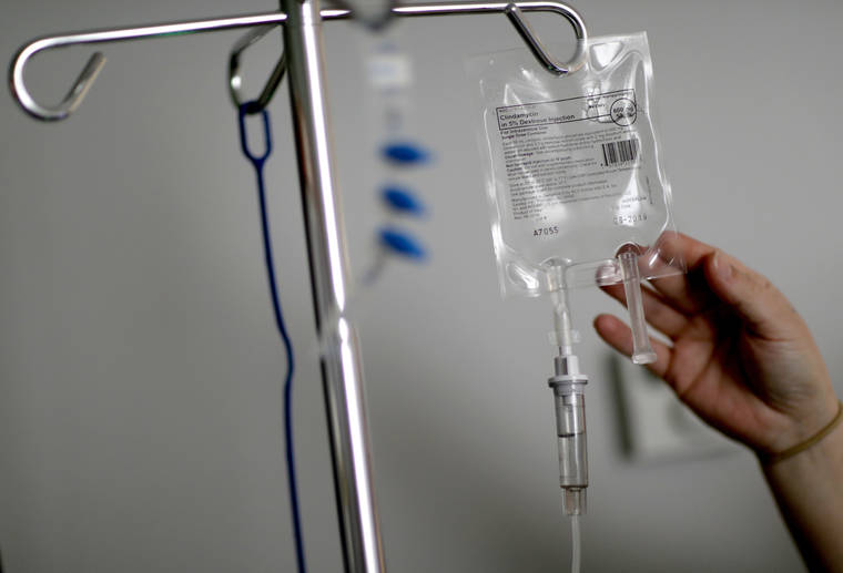 ASSOCIATED PRESS
                                A nurse hooked up an IV to a flu patient at Upson Regional Medical Center, in Feb. 2018, in Thomaston, Ga. Health insurance costs have climbed so high, there’s insurance for it.