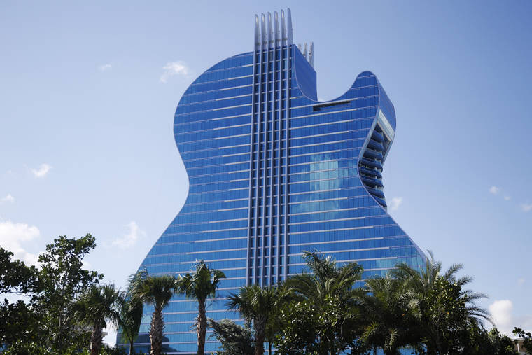 ASSOCIATED PRESS
                                The guitar shaped hotel is seen at the Seminole Hard Rock Hotel and Casino today in Hollywood, Fla.