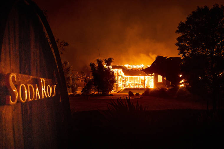 ASSOCIATED PRESS
                                Flames from the Kincade Fire consume Soda Rock Winery on Sunday in Healdsburg, Calif.