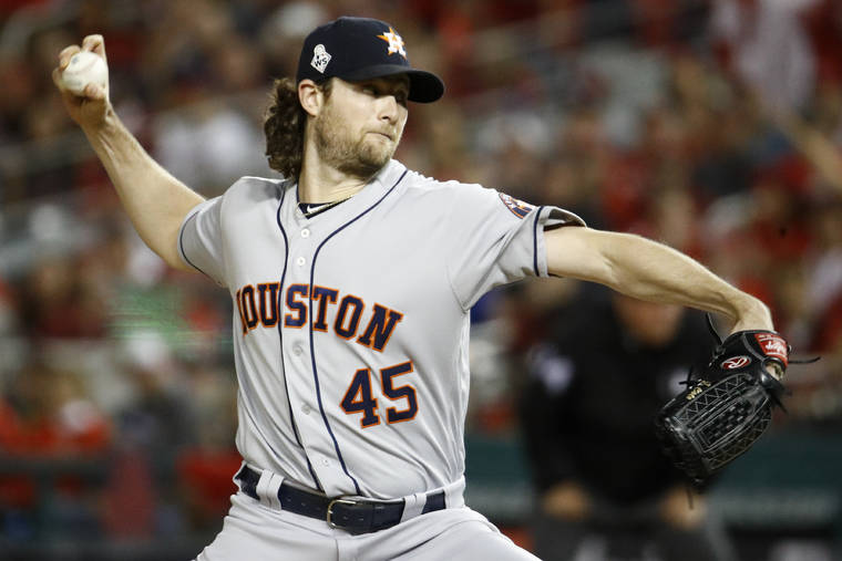 ASSOCIATED PRESS
                                Houston Astros starting pitcher Gerrit Cole throws against the Washington Nationals during the first inning.