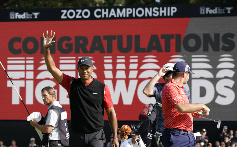 ASSOCIATED PRESS
                                Tiger Woods celebrates after winning the Zozo Championship.