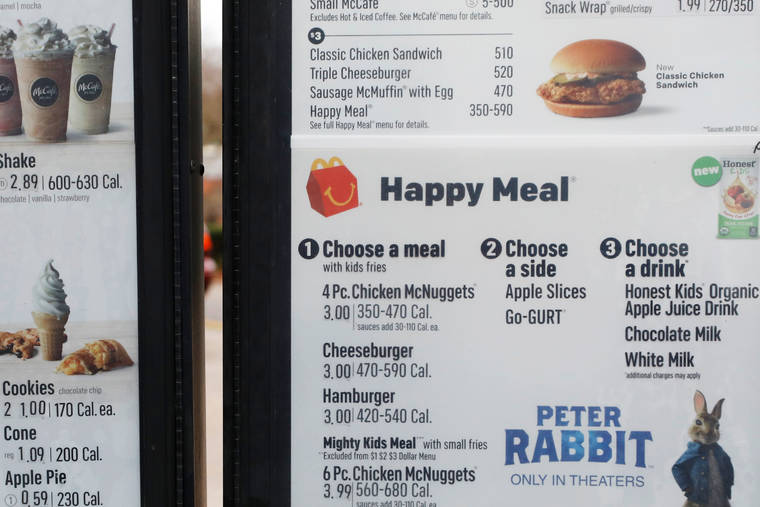 ASSOCIATED PRESS / Feb. 14, 2018
                                A McDonald’s drive-through menu shows calorie counts in Ridgeland, Miss. According to a study published today in the medical journal BMJ, customers at fast-food chains in Louisiana, Mississippi and Texas ordered an average of 60 fewer calories per transaction soon after the figures were displayed on menu boards.