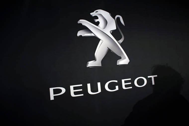 ASSOCIATED PRESS / 2018
                                The logo of Peugeot is displayed at PSA Peugeot Citroen headquarters during the presentation of the company’s 2017 full-year results, in Rueil-Malmaison, west of Paris, France. Italian-American carmaker Fiat Chrysler Automobiles confirmed that it is in talks with French rival PSA Peugeot, its second bid this year to reshape the global auto industry facing huge challenges with the transition to electric and autonomous vehicles.