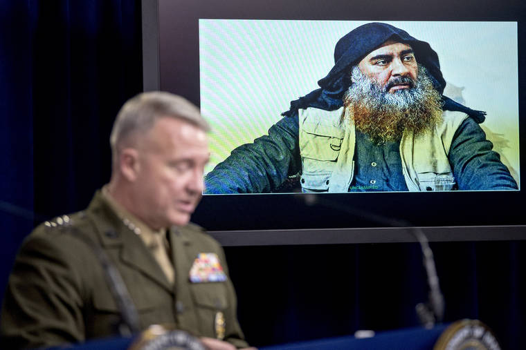 ASSOCIATED PRESS
                                Abu Bakr al-Baghdadi is displayed on a monitor as U.S. Central Command Commander Marine Gen. Kenneth McKenzie at a joint press briefing at the Pentagon in Washington, today, on the Abu Bakr al-Baghdadi raid.