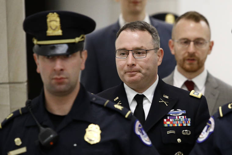 ASSOCIATED PRESS
                                Army Lt. Col. Alexander Vindman, a military officer at the National Security Council, departed a closed-door meeting after testifying as part of the House impeachment inquiry into President Donald Trump, Tuesday, on Capitol Hill in Washington.