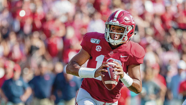 ASSOCIATED PRESS
                                Alabama quarterback Tua Tagovailoa rolls out against Mississippi during the first half of an NCAA college football game on Sept. 28 in Tuscaloosa, Ala.