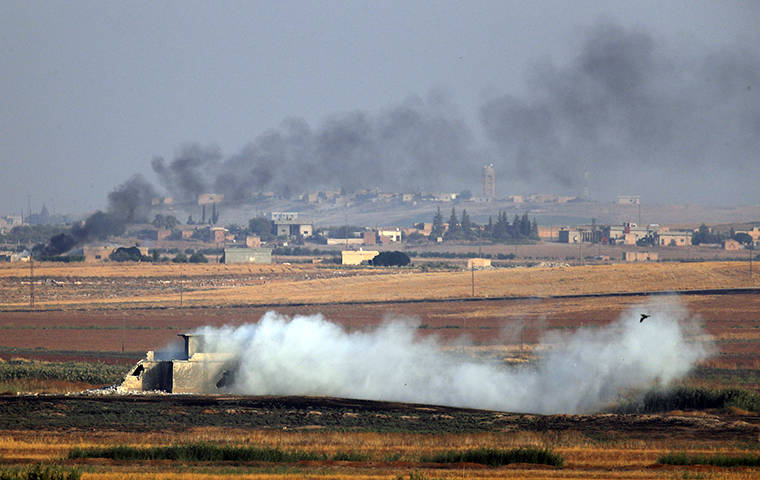 ASSOCIATED PRESS
                                Smoke billowed from targets inside Syria during bombardment by Turkish forces, today. Turkey launched a military operation today against Kurdish fighters in northeastern Syria after U.S. forces pulled back from the area, with a series of airstrikes hitting a town on Syria’s northern border.