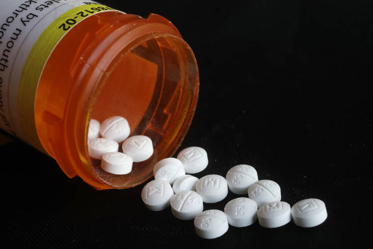 ASSOCIATED PRESS / 2018
                                An arrangement of prescription oxycodone pills in New York. U.S. health officials are again warning doctors against abandoning chronic pain patients by abruptly stopping their opioid prescriptions. The U.S. Department of Health and Human Services instead urged doctors to share such decisions with patients.