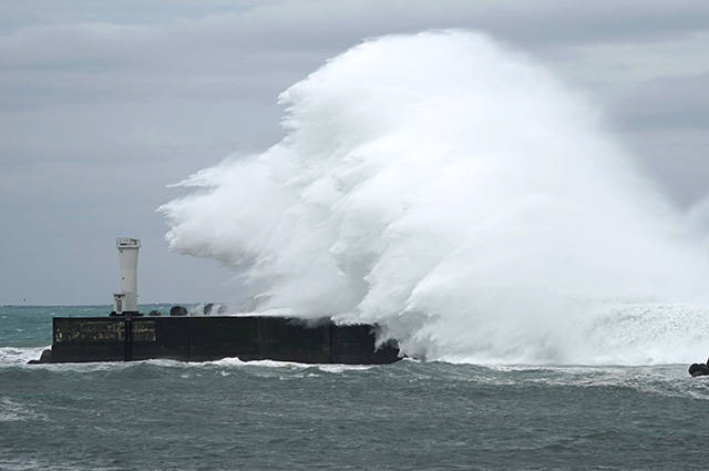 ASSOCIATED PRESS
                                Surging waves hit against the breakwater while Typhoon Hagibis approaches at a port in town of Kiho, Mie prefecture, central Japan Friday, Oct. 11, 2019. A powerful typhoon is advancing toward the Tokyo area, where torrential rains are expected this weekend.