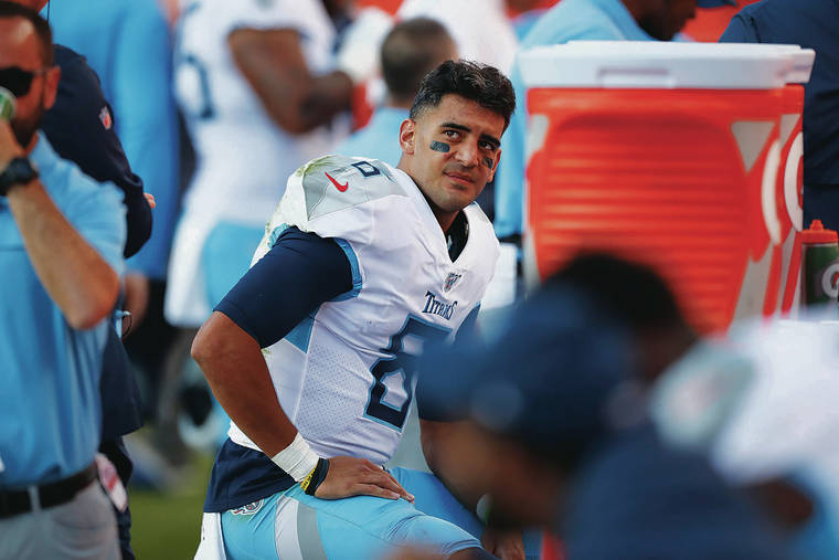 ASSOCIATED PRESS
                                Tennessee Titans quarterback Marcus Mariota looked on from the sideline during the second half of a game against the Denver Broncos, Sunday, in Denver.